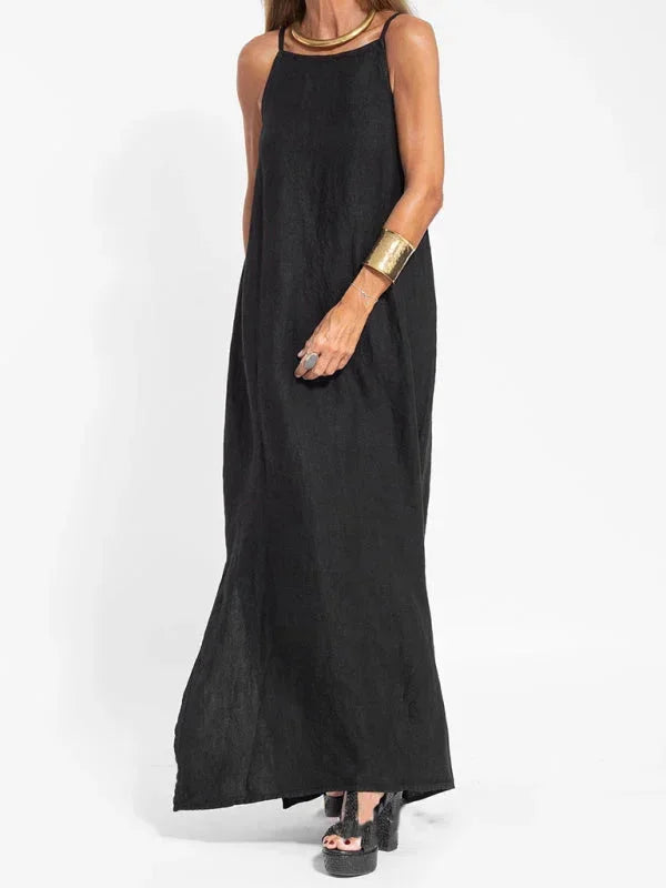 Women's comfortable summer maxi dress, sleeveless, flowy, and long, with a sophisticated side slit.