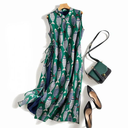 Women's flowy sleeveless maxi dress with playful fish print, perfect for summer beach casual wear.