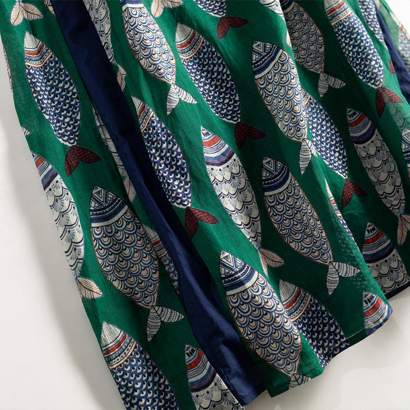 Comfortable women's flowy maxi dress, sleeveless, adorned with a unique and playful fish print pattern.