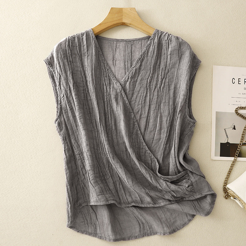 Crinkled women's sleeveless top with a relaxed, flowy fit, ideal for effortless summer style and vacation outfits.