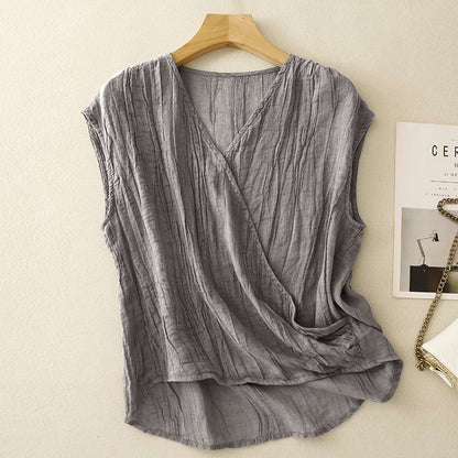 Crinkled women's sleeveless top with a relaxed, flowy fit, ideal for effortless summer style and vacation outfits.