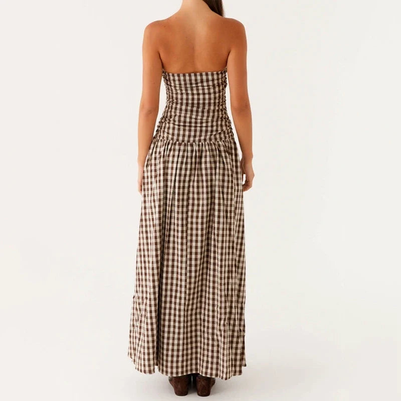 Versatile women's flowy strapless maxi dress for summer, suitable for day events or evening parties.