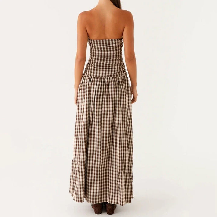 Versatile women's flowy strapless maxi dress for summer, suitable for day events or evening parties.