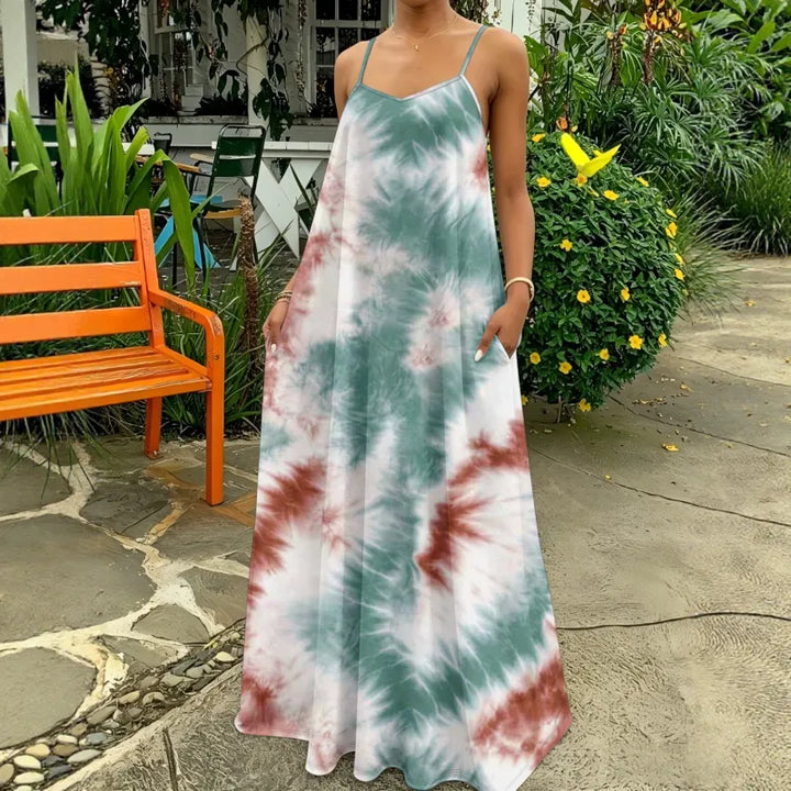 Women's flowy tie-dye maxi dress with narrow straps, perfect for summer casual wear or vacation outfits.