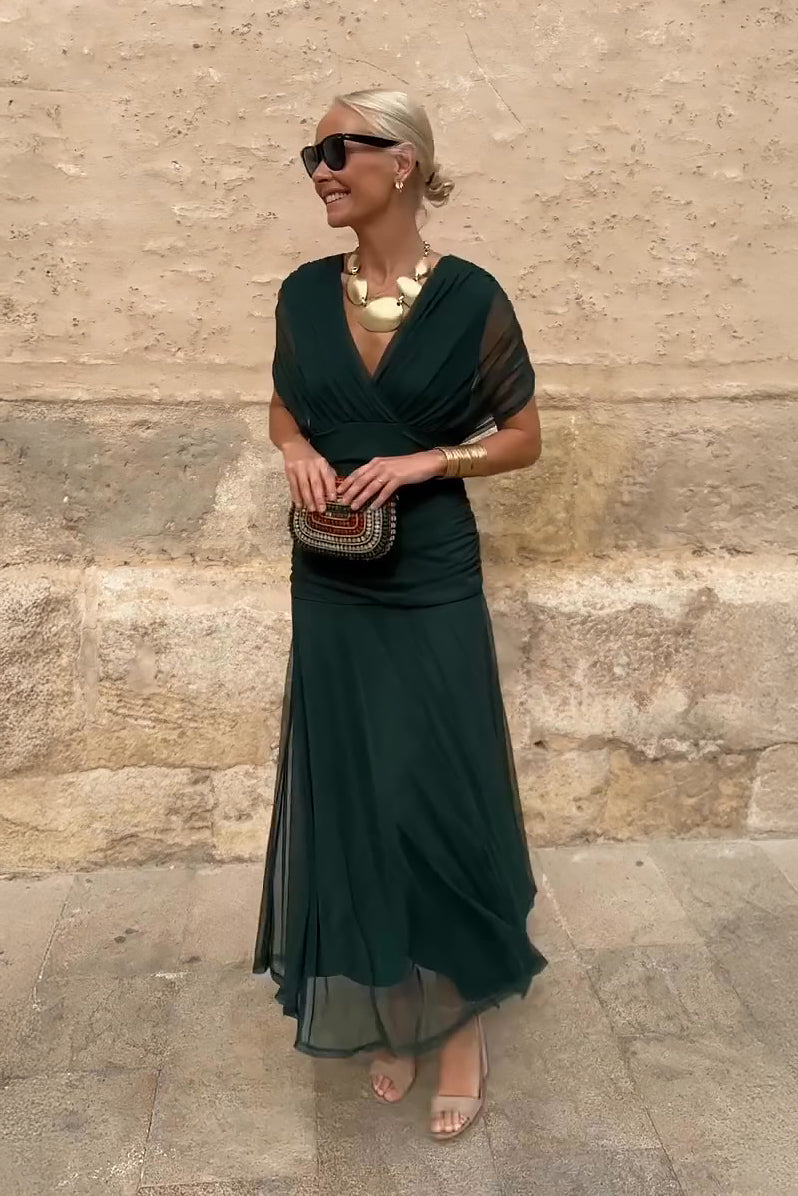 Women's flowy V-neck maxi dress with delicate flutter sleeves, perfect for elegant occasions.