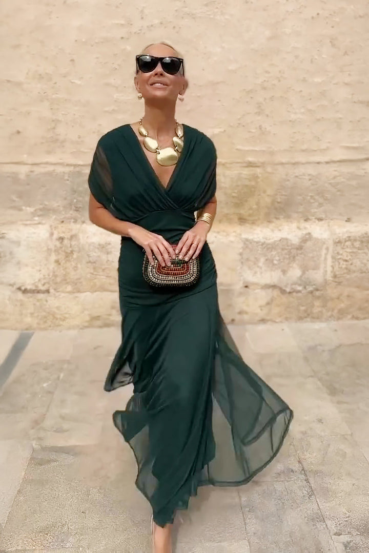 Stylish women's spring/summer flowy V-neck maxi dress with flutter sleeves, comfortable & chic.