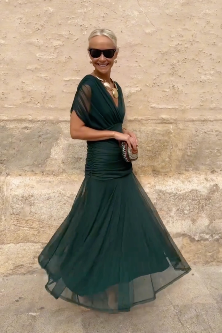 Stunning V-neck maxi dress for women featuring airy flutter sleeves and a graceful flowy silhouette.