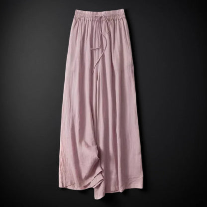 Casual women's flowy wide-leg pants with an adjustable drawstring waist, offering a relaxed and comfy fit.