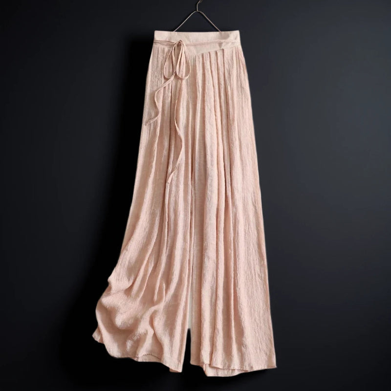 Women's flowy wide-leg summer pants with tie waist in a relaxed fit, perfect for casual vacation wear.