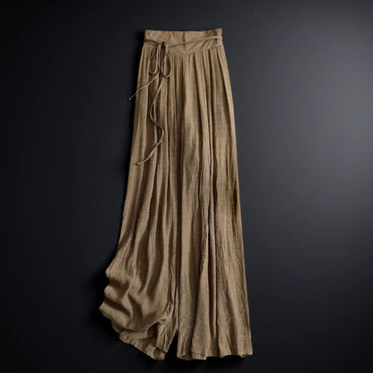 Casual women's flowy wide-leg summer pants with a chic tie-waist. Ideal for beach, travel, or relaxed everyday wear.