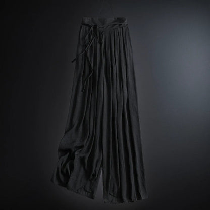 Lightweight women's flowy wide-leg summer pants with a flattering high waist and adjustable tie. Effortlessly stylish.