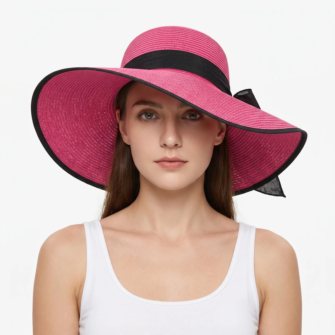Lightweight women's travel sun hat with a wide floppy brim. Easily packable for vacation, beach, or resort wear.