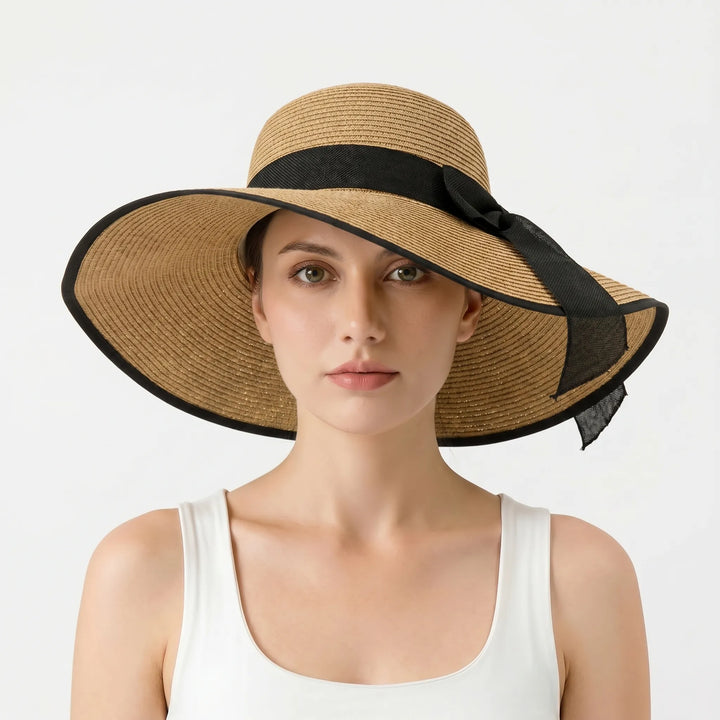 Versatile women's foldable floppy sun hat. This wide brim beach hat is a must-have for summer vacation & resort style.
