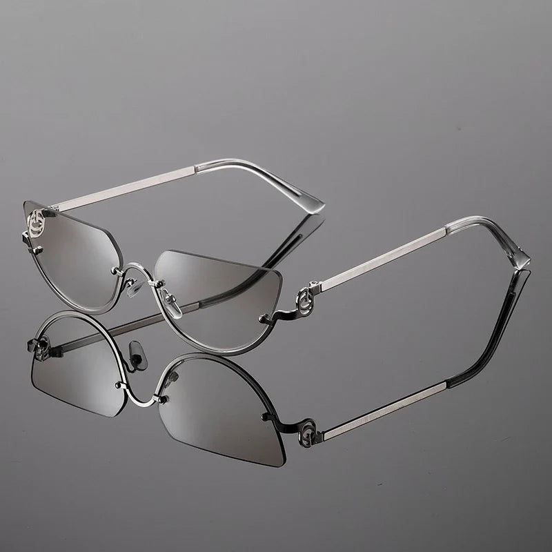 Stylish women's frameless sunglasses featuring unique angular lenses and sleek metal temples for a chic look.