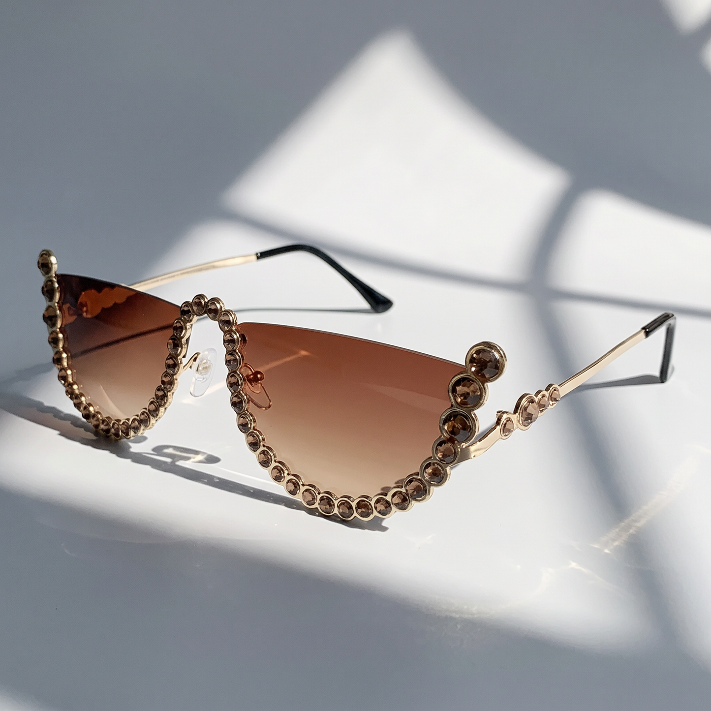 Women's frameless oval sunglasses. Lightweight, chic UV400 eyewear, perfect for outdoor and travel.