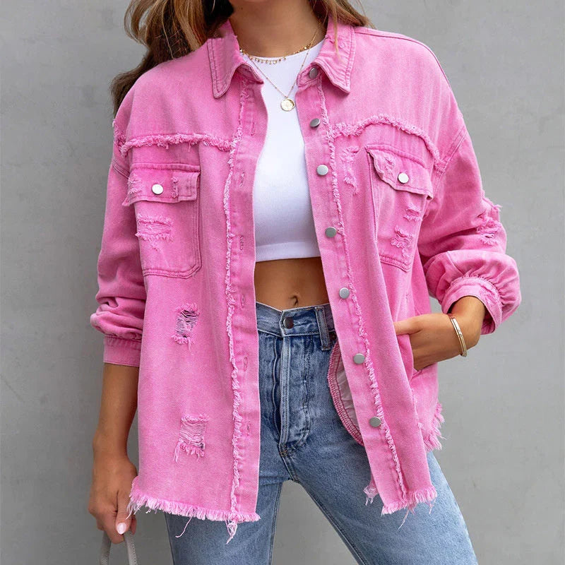Trendy women's distressed denim jacket featuring frayed edges and a relaxed fit for casual outerwear.