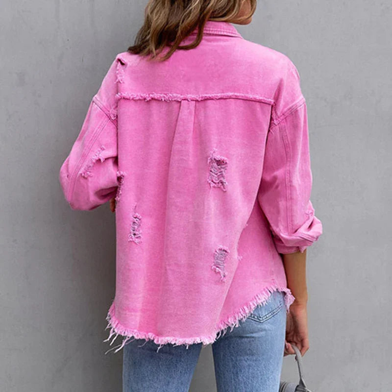 Chic women's denim jacket, frayed and distressed, a versatile statement piece for trendy casual outfits.