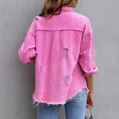 Chic women's denim jacket, frayed and distressed, a versatile statement piece for trendy casual outfits.