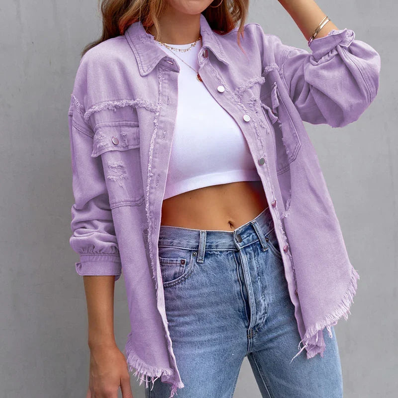 Fashion-forward women's frayed denim jacket with stylish distressed details, ideal for layering outerwear.