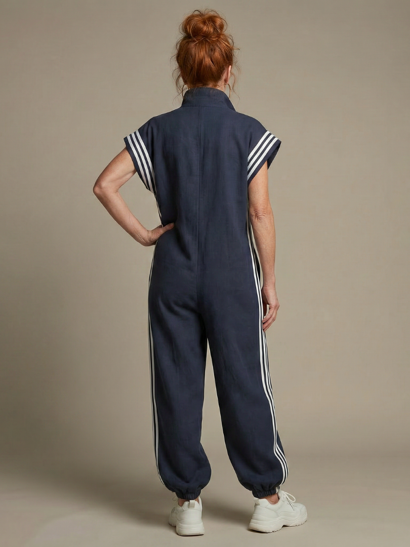 Sporty full length women's jumpsuit, side stripe detail, zip front & cap sleeves.