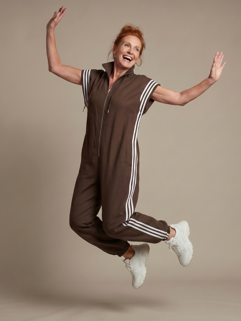 Versatile women's full length jumpsuit, high neck, cap sleeve & sporty side stripe.
