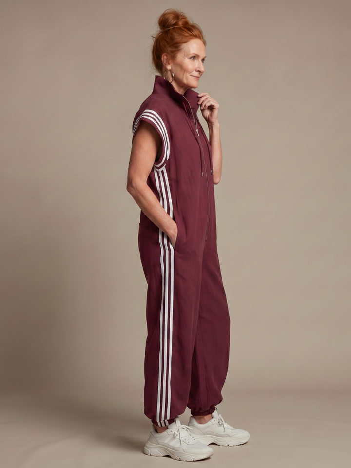 Sporty women's full length jumpsuit, zip front, side stripe & cap sleeves.