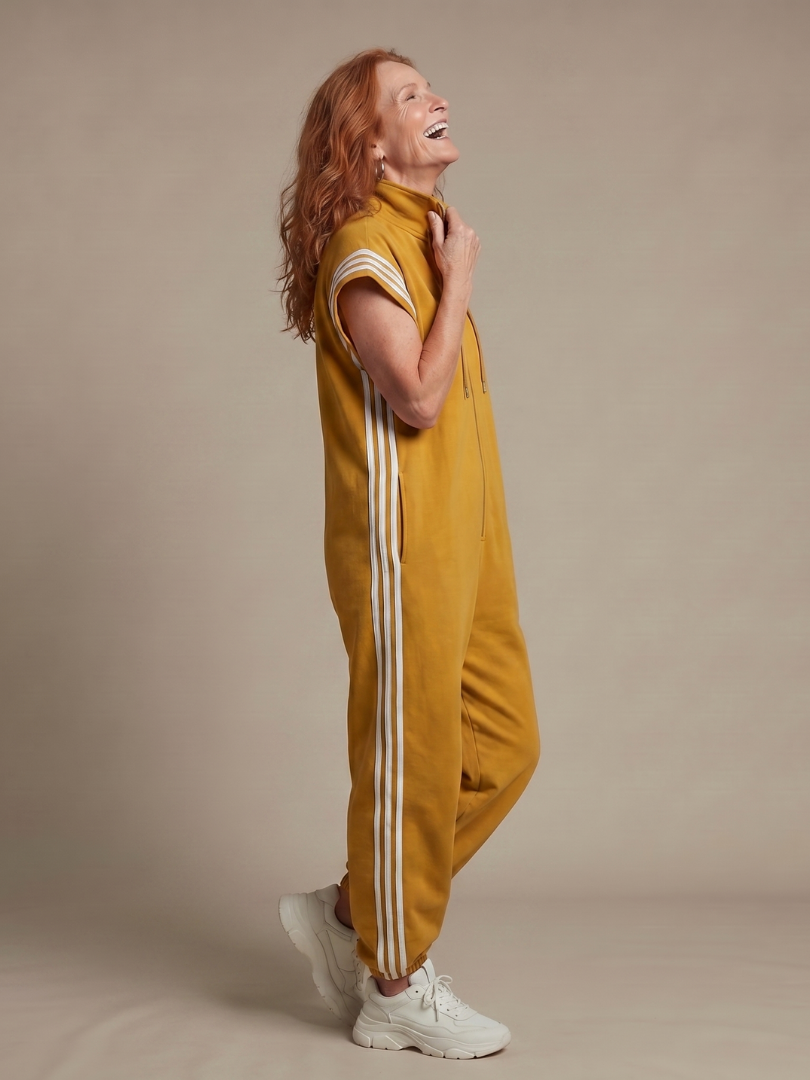 Versatile women's sporty full length jumpsuit, zip front & side stripe detail.