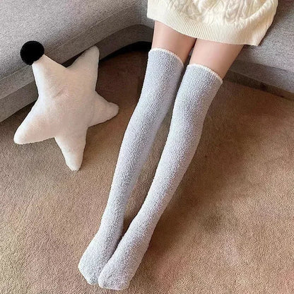 Assorted set of women's fuzzy knee-high socks in various solid colors for cozy winter comfort and warmth.