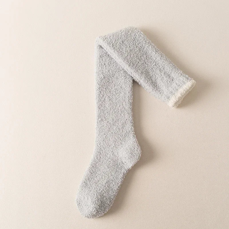 Comfortable women's fuzzy knee-high socks, designed for warmth, softness, and cozy loungewear.