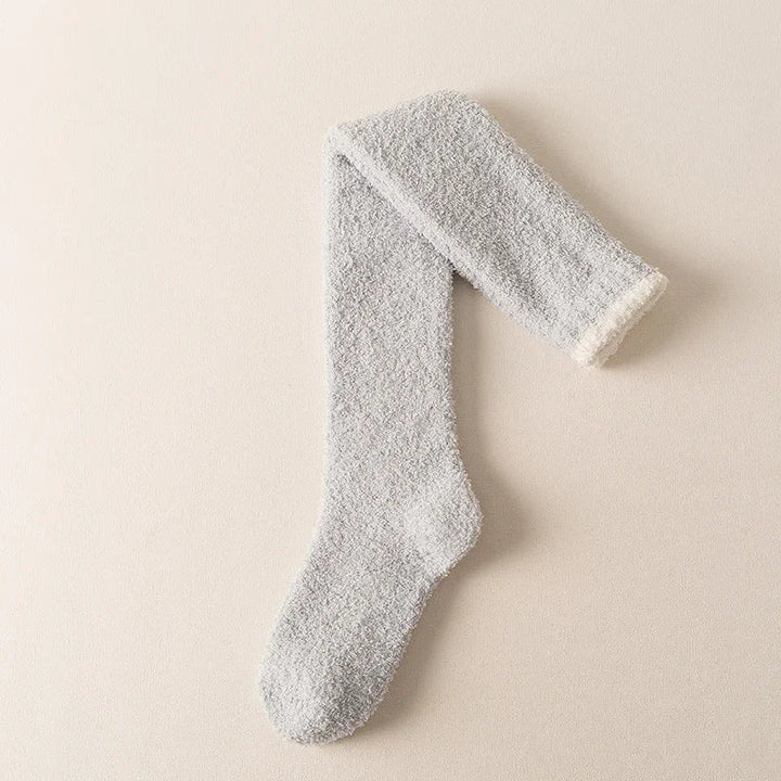 Comfortable women's fuzzy knee-high socks, designed for warmth, softness, and cozy loungewear.