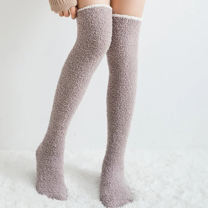Stylish khaki fuzzy knee-high socks for women, providing warmth and soft comfort as a winter accessory.