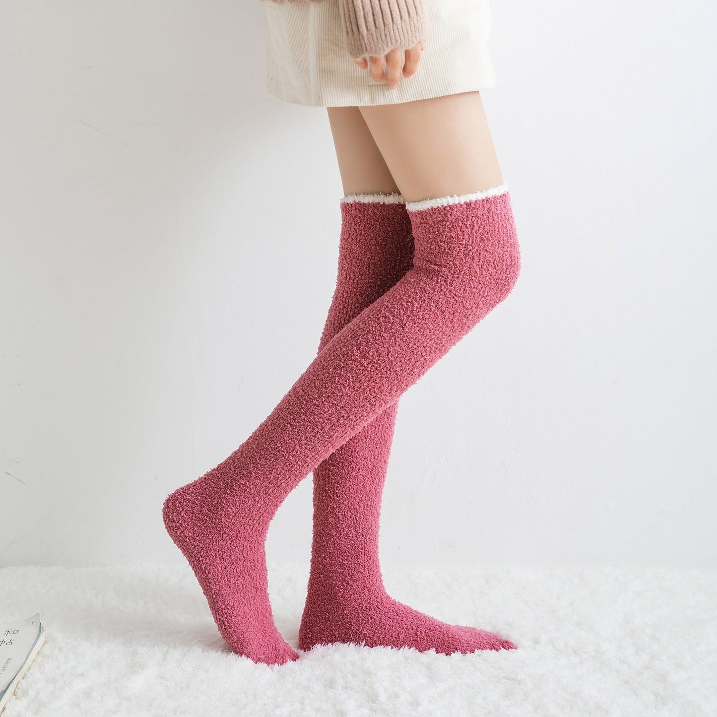 Elegant black fuzzy knee-high socks for women, offering ultimate softness, warmth, and winter comfort.