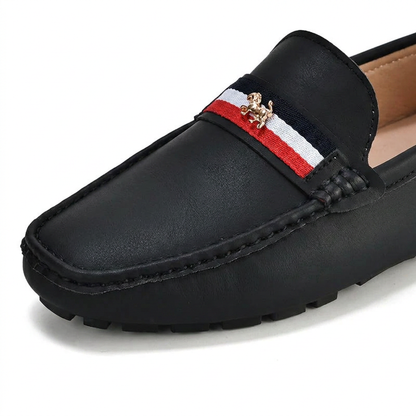 Women's striped loafers, providing stylish slip-on comfort for casual and warm weather wear.