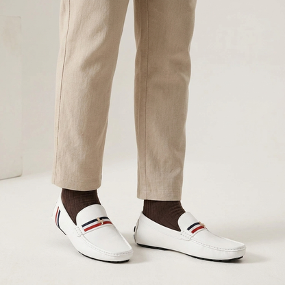 Stylish women's slip-on striped loafers, perfect for a comfortable and fashionable warm-weather outfit.