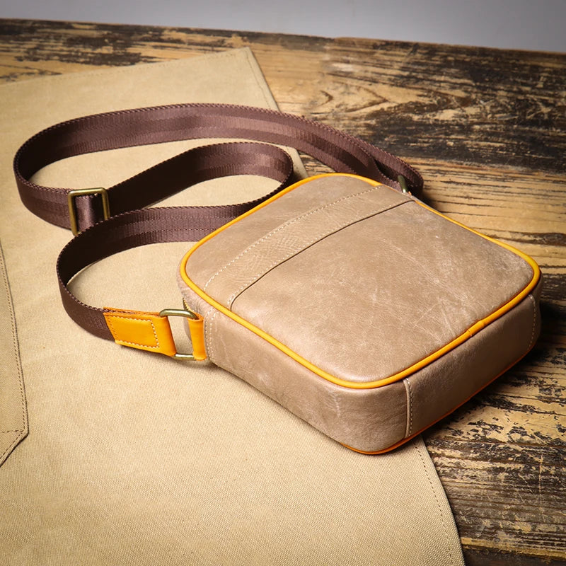 Compact genuine leather crossbody bag for women. Adjustable strap ensures a perfect fit for any outfit.