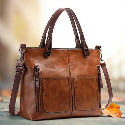 Women's genuine leather handbag, durable with adjustable strap. Perfect shoulder or crossbody bag.