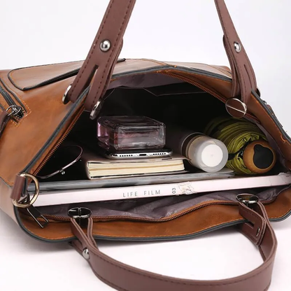Women's versatile leather shoulder & crossbody bag with adjustable strap. A durable and elegant fashion accessory.