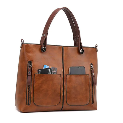 Genuine leather women's handbag, a chic and durable accessory. Features an adjustable strap for crossbody or shoulder wear.