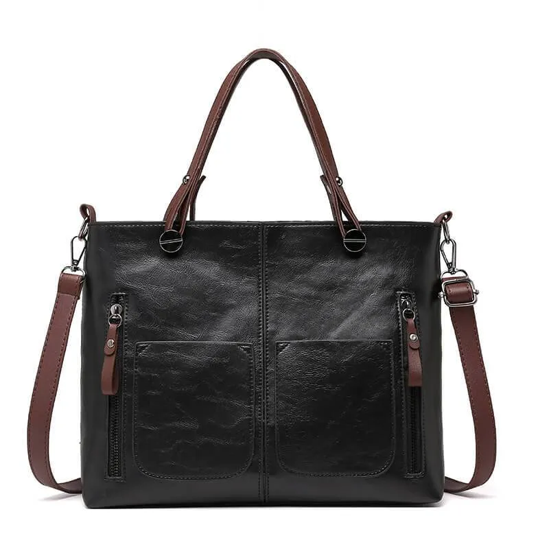 Classic brown women's durable leather handbag. Versatile as a shoulder or crossbody bag with adjustable strap.
