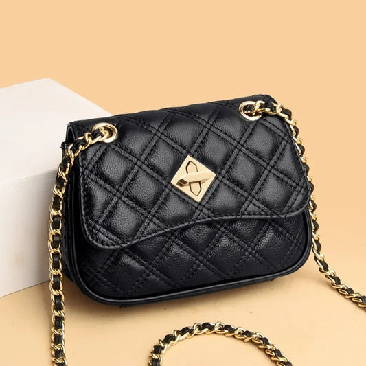 Women's genuine leather quilted handbag with chain strap. Elegant and luxurious compact crossbody purse.