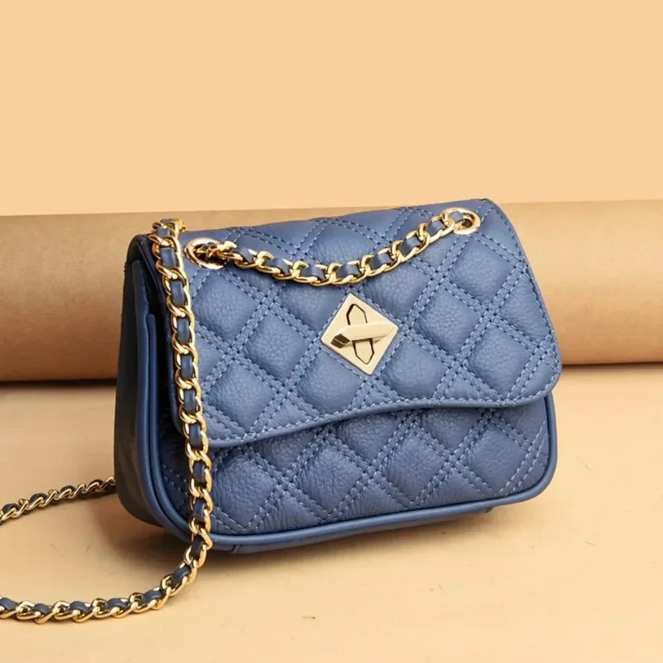 Stylish women's genuine leather quilted crossbody bag. Can be worn as a shoulder bag. Luxury compact purse.