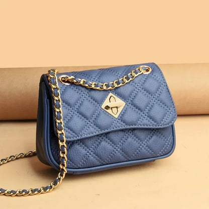 Stylish women's genuine leather quilted crossbody bag. Can be worn as a shoulder bag. Luxury compact purse.