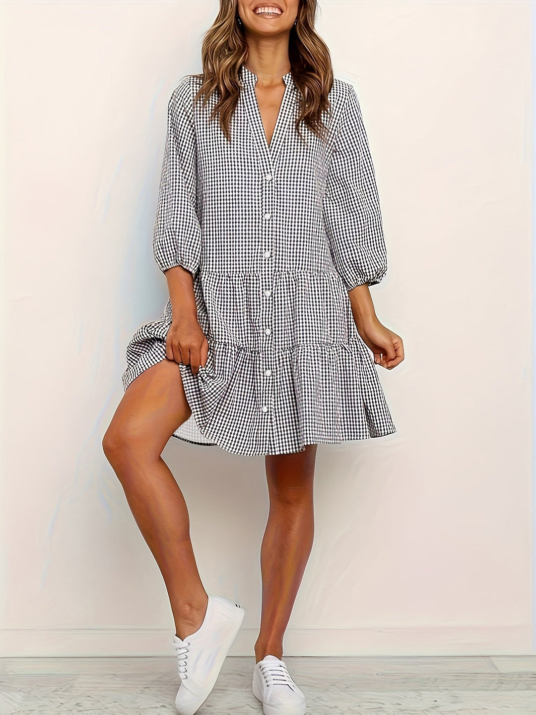 Chic women's tiered mini dress, gingham check pattern, puff sleeves & button front, ideal for vacation.