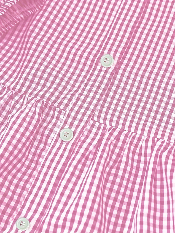 Stylish women's gingham check button front tiered mini dress with playful ruffle details, perfect for summer.
