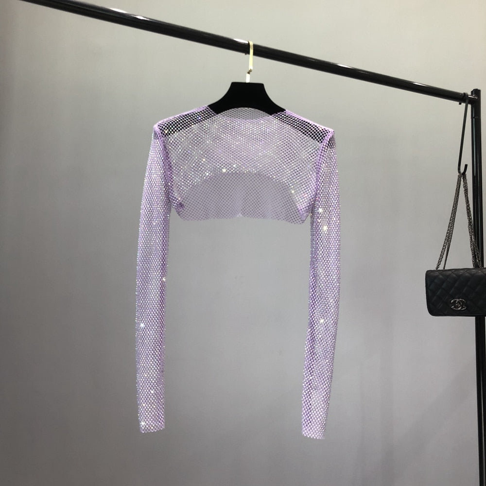 Stylish women's sheer net top with dazzling rhinestones. Perfect for evening wear & a statement party look.