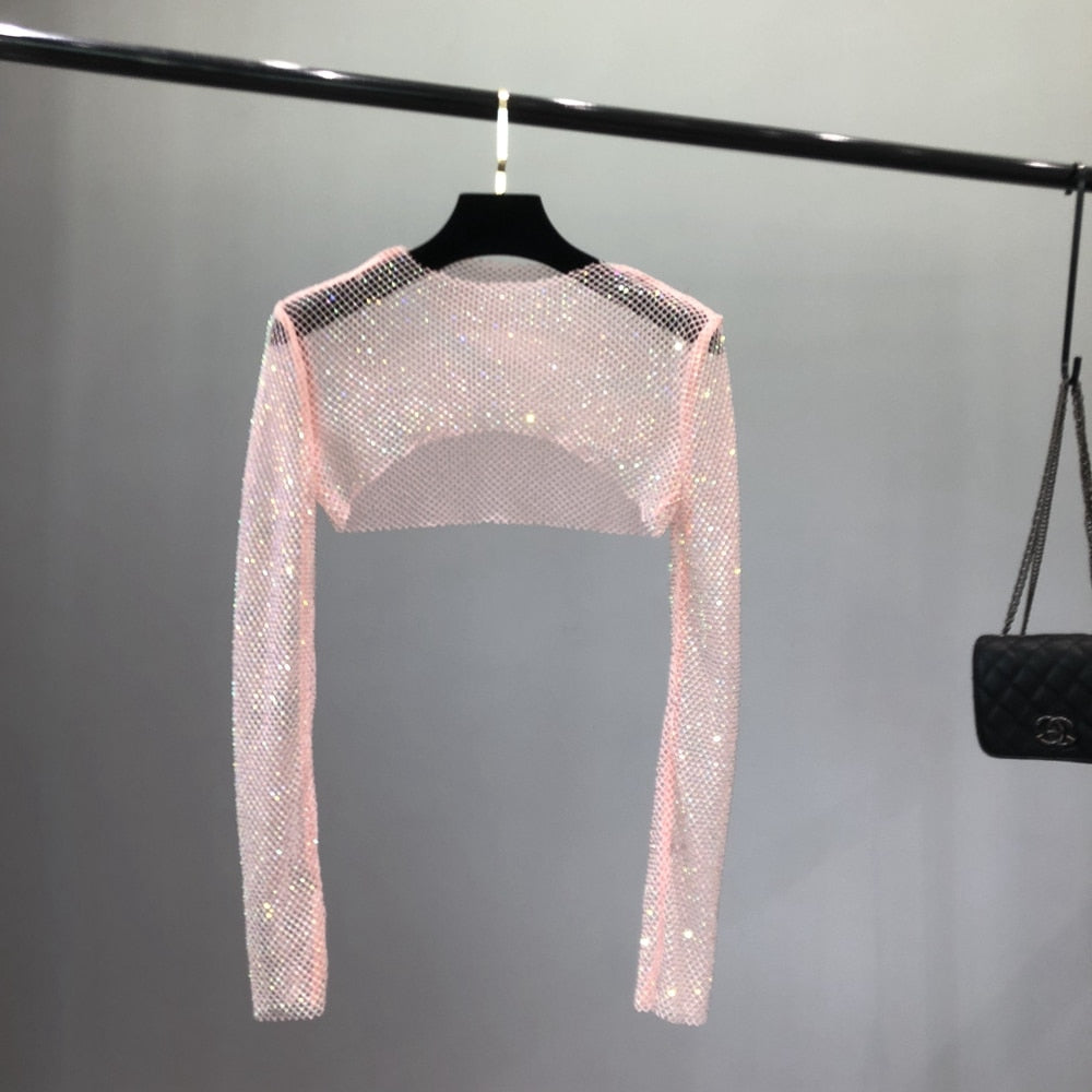 Glamorous women's rhinestone party top, a sparkling statement piece for clubwear, evening & night out.