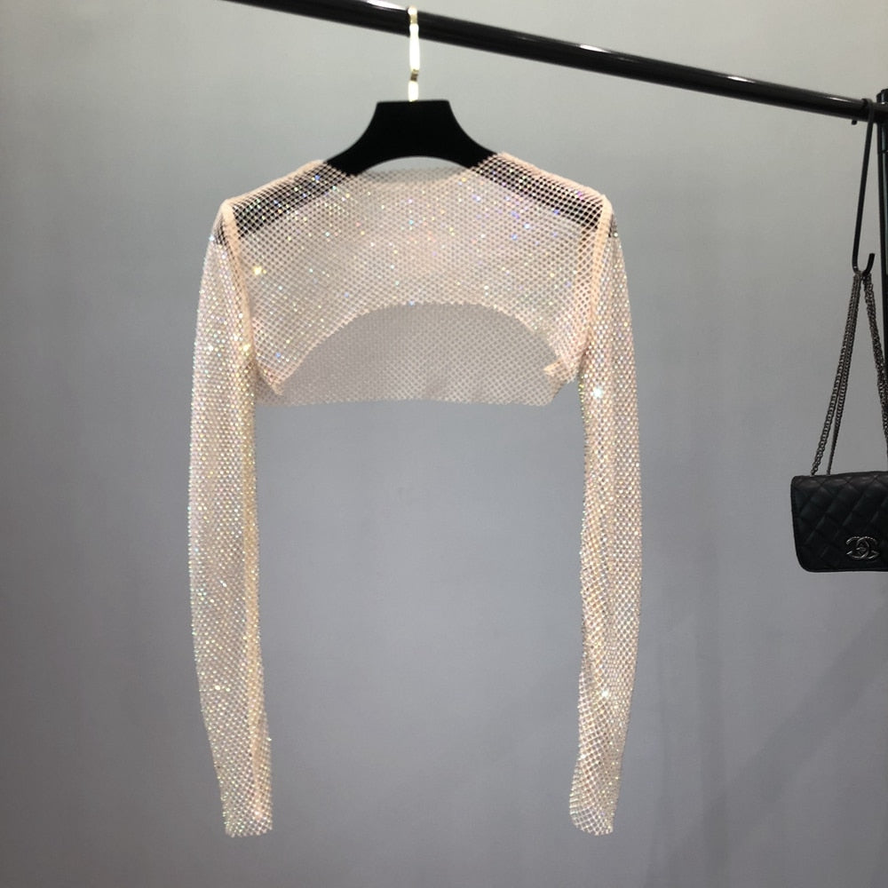 Women's fashion sheer mesh top with glittering rhinestones. Elegant party & clubwear for a dazzling night.