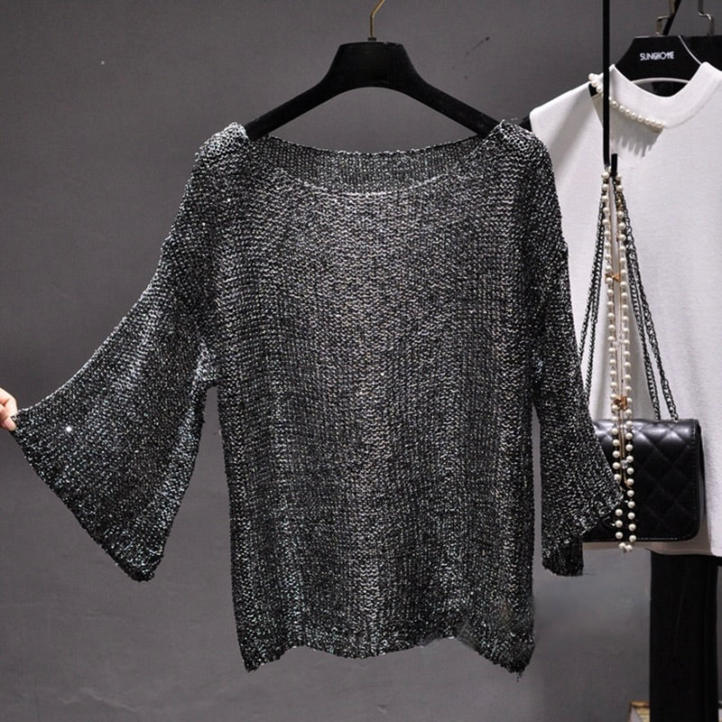 Comfortable women's sequin knit sweater. Stylish long sleeve top with glamorous sparkle, ideal for fashion-forward party outfits.