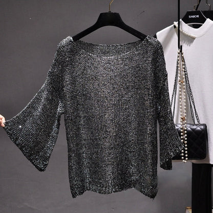 Comfortable women's sequin knit sweater. Stylish long sleeve top with glamorous sparkle, ideal for fashion-forward party outfits.