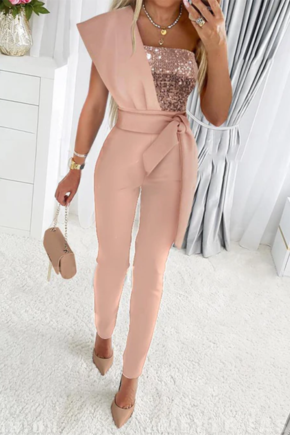 Sparkling sequin jumpsuit for women, ideal party outfit and formal evening wear.